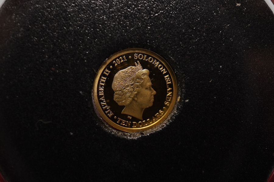 British and British dependencies gold coins, Elizabeth II gold proof half sovereign, 1980, in case of issue with certificate and a Solomon Islands, Elizabeth II proof gold $10 coin, Harrington & Byrne slip case (2)